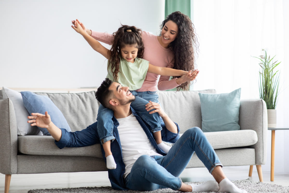 Happy people in a home, attracting better tenants with a property manager concept